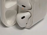 a pair of airpods that are sitting on a table