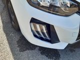 a close up of a car ' s headlight and front bumper