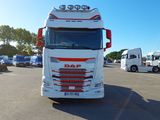 a large white truck parked in a parking lot