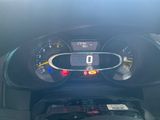 a car dashboard with a speedometer and a dash light