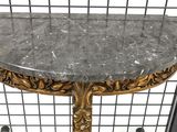 a table with a marble top on a metal shelf