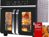 a black and silver air fryer oven with baked goods in it