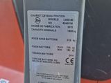 a close up of a parking meter with a sticker on it