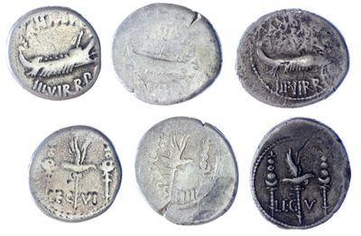 six different types of coins are shown on a white surface