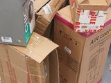 many boxes stacked on top of each other on the ground
