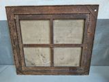 an old wooden window with a glass pane in it