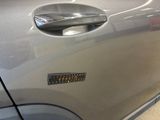 a close up of a car door handle with a sticker on it