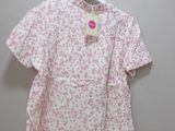 the shirt is pink and white with pink flowers on it