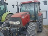 two tractors parked next to each other in a parking lot