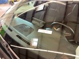 a reflection of a car in the windshield of a car