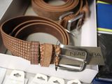 a brown belt that is sitting in a box