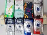 many different types of coffee bags on the table