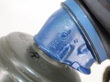 a close up of a water bottle with a hose attached to it
