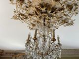 a chandelier hanging from the ceiling in a room
