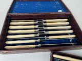 a wooden box with eight wooden baseball bats in it