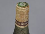 a bottle of wine that is sitting on a table