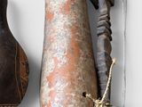 three different types of gourds and a knife on a table