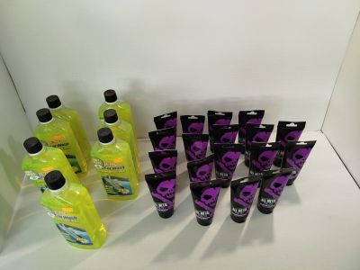 a lot of bottles of purple and black liquid on the counter