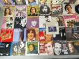 a lot of music cds on the table together