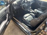 a black car with black leather seats and a black dashboard