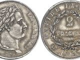 a close up of a coin with a woman ' s face on it