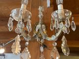 a crystal chandelier hanging from the ceiling in a room