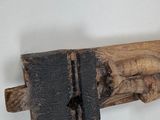 a piece of wood with a piece of wood sticking out of it
