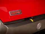 a close up of a red car with a number plate on it