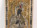an image of a silver and gold plated icon of the virgin mary