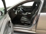 a silver car with its door open next to a silver car with its door open