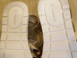 a pair of shoes that are sitting on a wooden floor