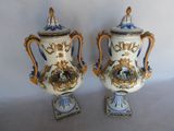 two vases that are sitting side by side on a table