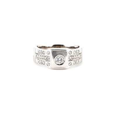 a close up of a ring with a diamond on it