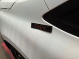 a close up of a sticker on the side of a car