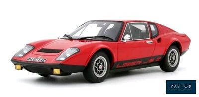the red sports car is parked on a white surface