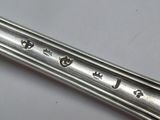 a close up of a spoon and a fork on a table