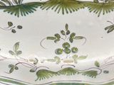 a plate with a bird on it sitting on a table