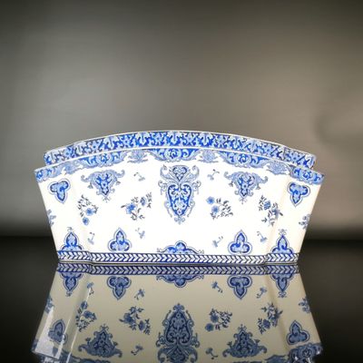 a blue and white bowl sitting on a table