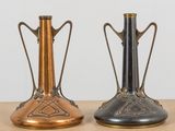 two vases that are sitting on a table