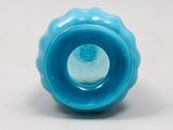a small blue vase with a hole in the middle