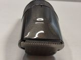 a close up of a small black object on a white surface