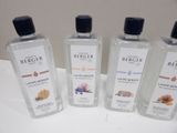 three bottles of hand sanitizer sitting on a table