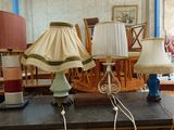 two lamps that are on a table in a room