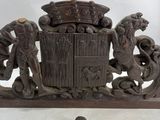 an image of a wooden sculpture with a lion and a lion on it