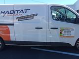 a white van that is parked in a parking lot