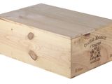 a wooden box with a label on it on a white background