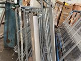 a pile of metal items sitting outside of a building
