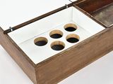 a wooden box with four holes in it