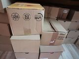 many boxes stacked on top of each other on the floor