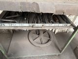 an image of a metal shelf with tools on it